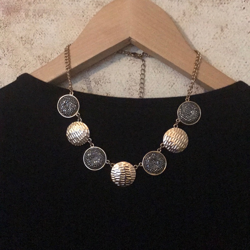 gold and shiny black necklace